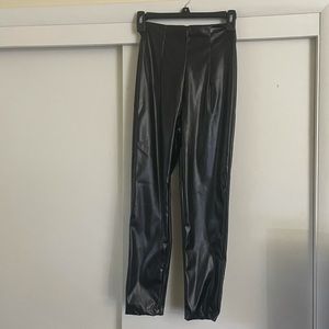 Princess poly faux leather skinny pants with zipper in back.